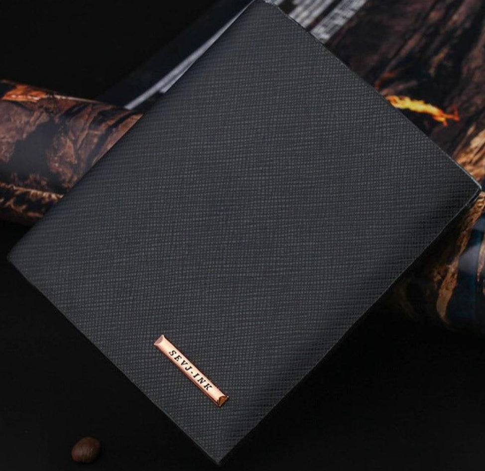 Black textured wallet with a brand logo on a dark background