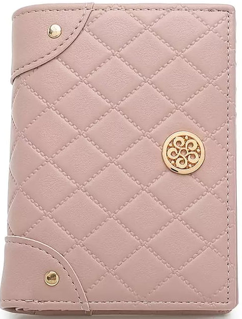 Quilted pink wallet with gold accents on a white background