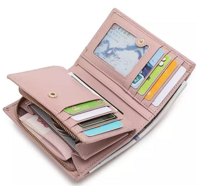 Pink wallet with card slots and a coin pocket on a white background