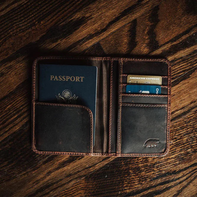 brown leather passport wallet with card slots.